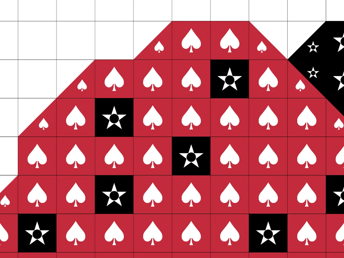 A close view of a printed chart, where the squares along a curved edge are split diagonally and each half carries its own smaller symbol, so the two colours in one square can be told apart